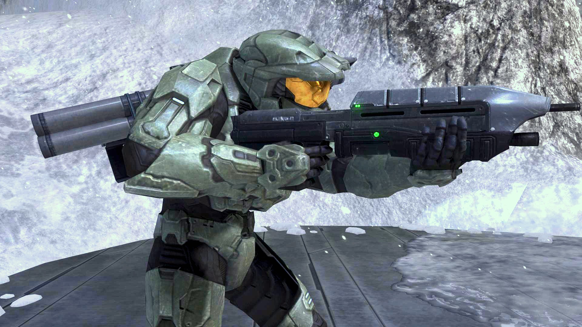an halo master is holding a machine gun in front of a snowy mountain