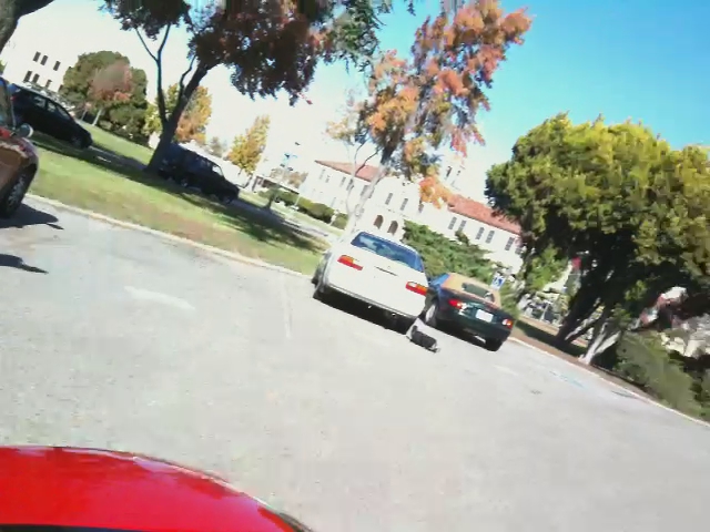 the camera is being used to capture cars driving down a street