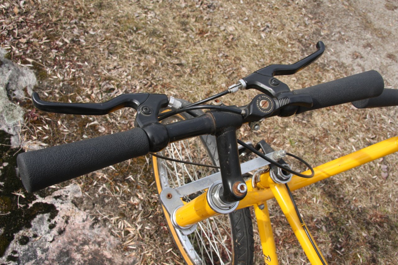 a bike parked next to a stone wall