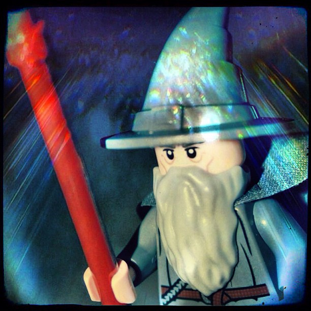 this is an image of a lego wizard with a big red axe