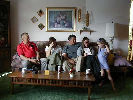 an image of a family sitting on couch in the living room