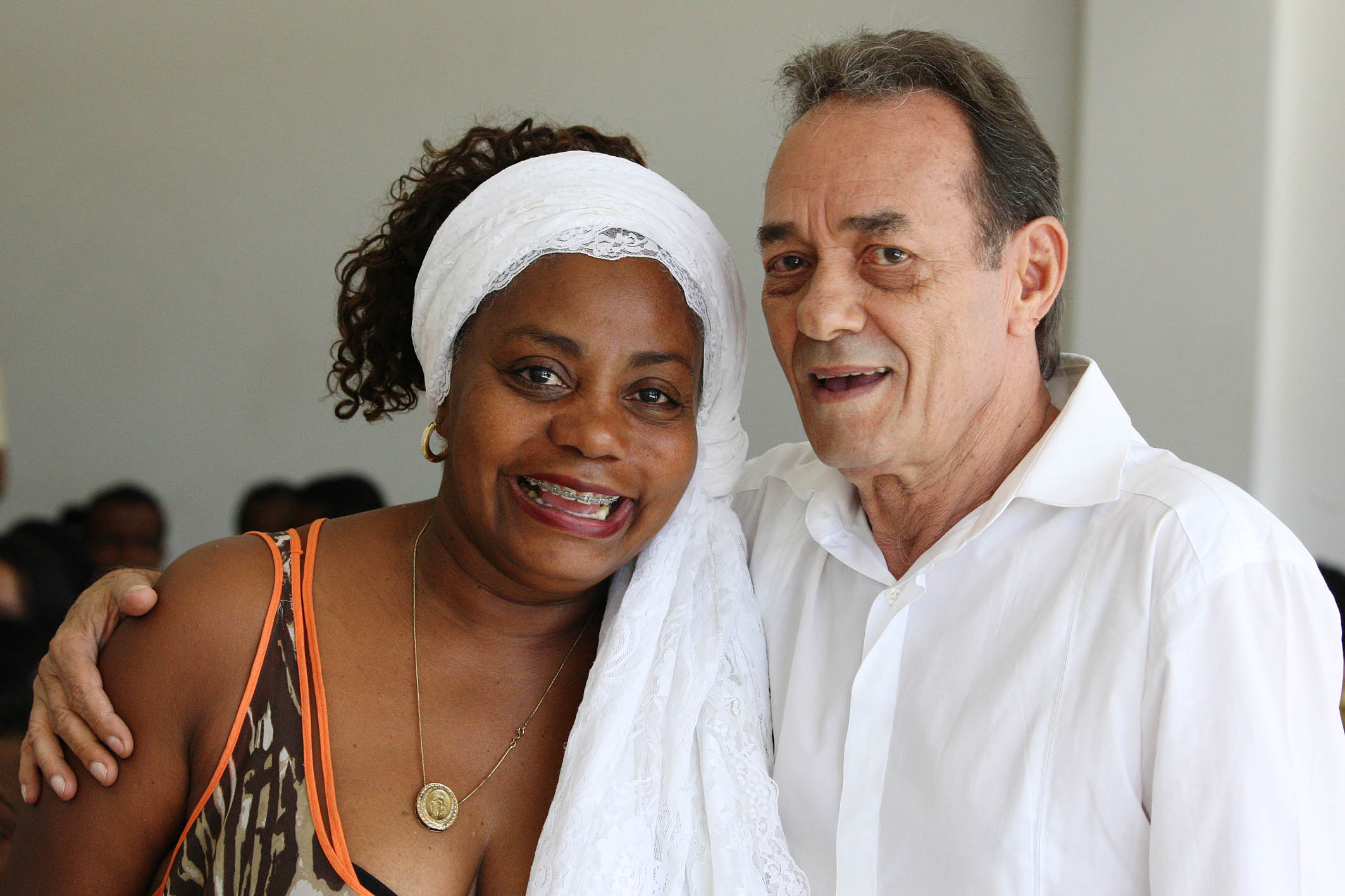 a man with a white shirt and a woman with a brown dress