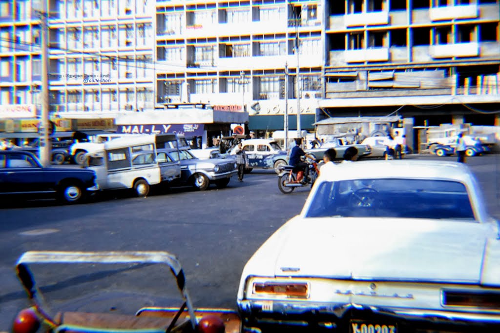 cars, motorcycles and motorcycles parked on a street