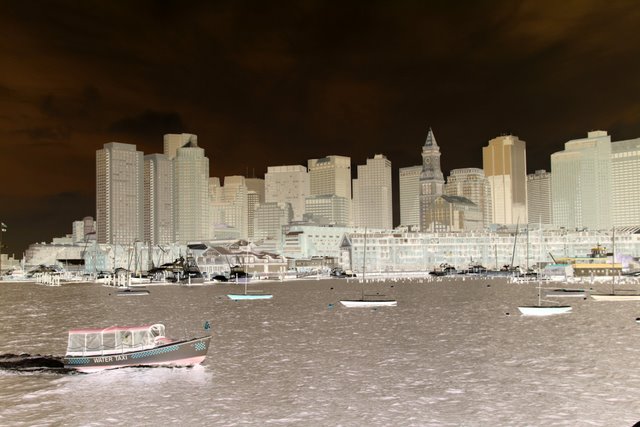 an image of a large body of water with a city in the background