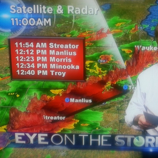a tv newscast showing weather with a map