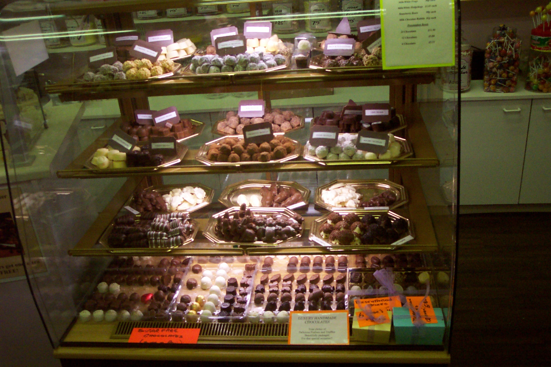 a display case filled with lots of different kinds of sweets