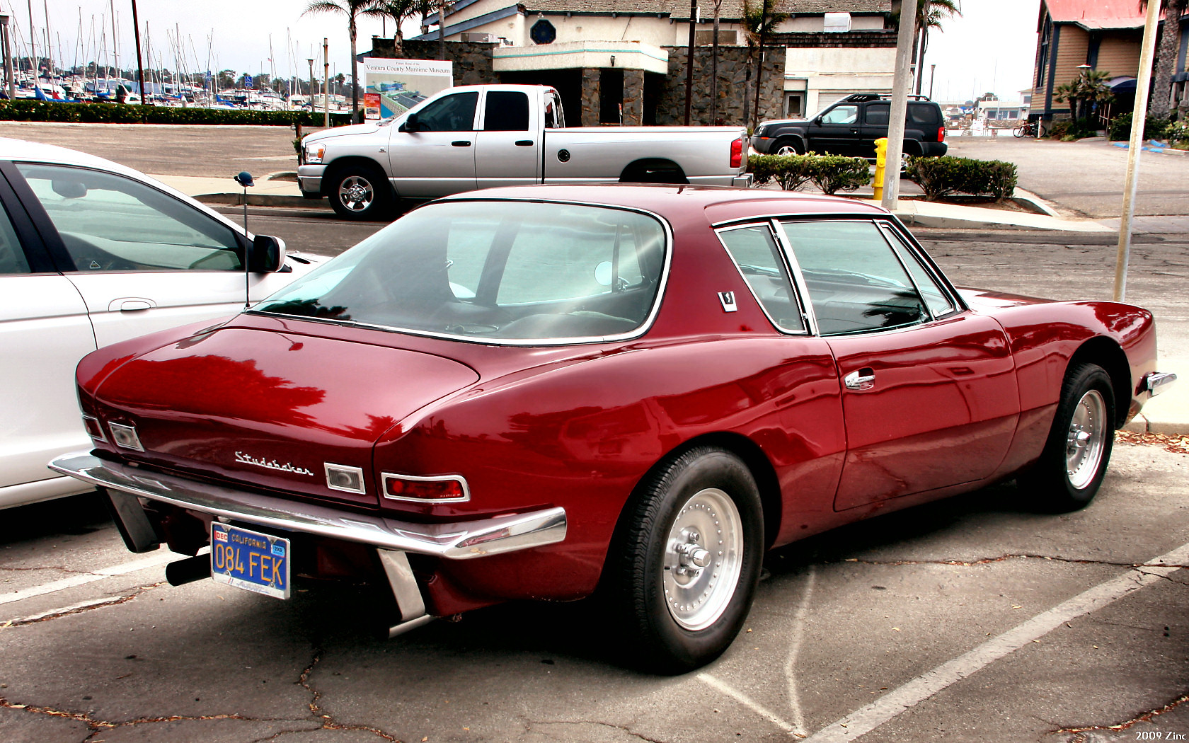 a red car parked in a parking space