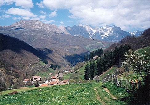 a mountain side village is nestled on a hillside