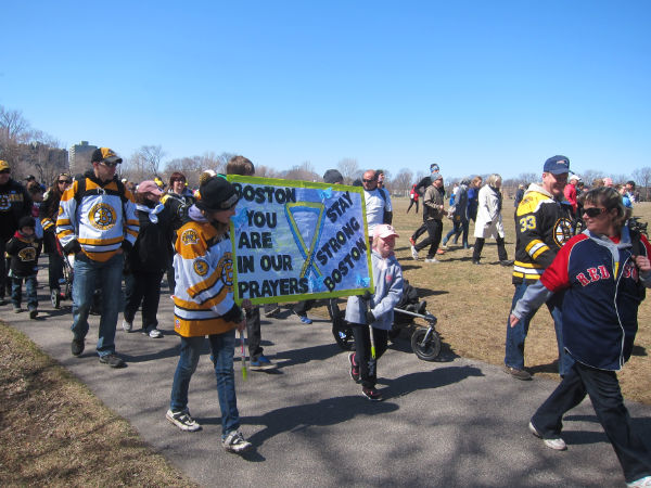 a group of people holding a sign that says,