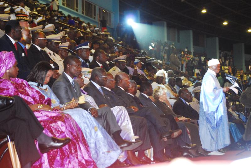 some people in front of a crowd sitting down