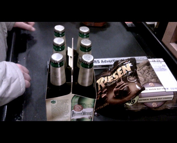 several beer bottles in a display case in a store