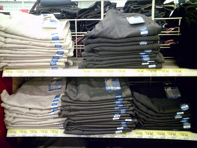 shelves full of clothes and one filled with jeans