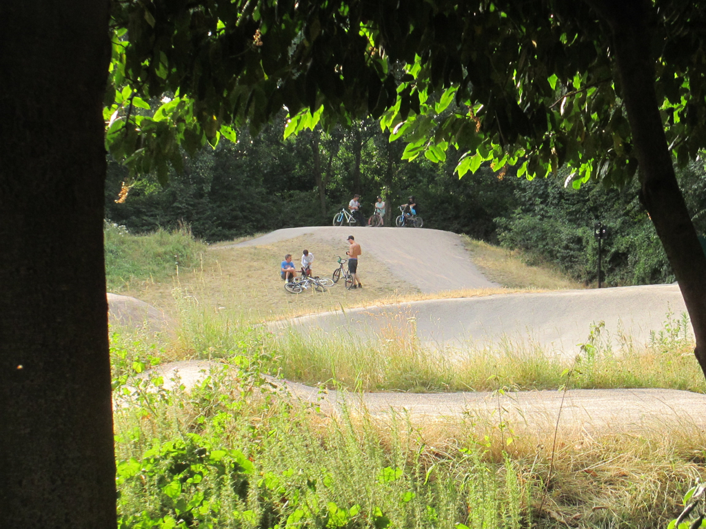 there are people riding bicycles in a rural area