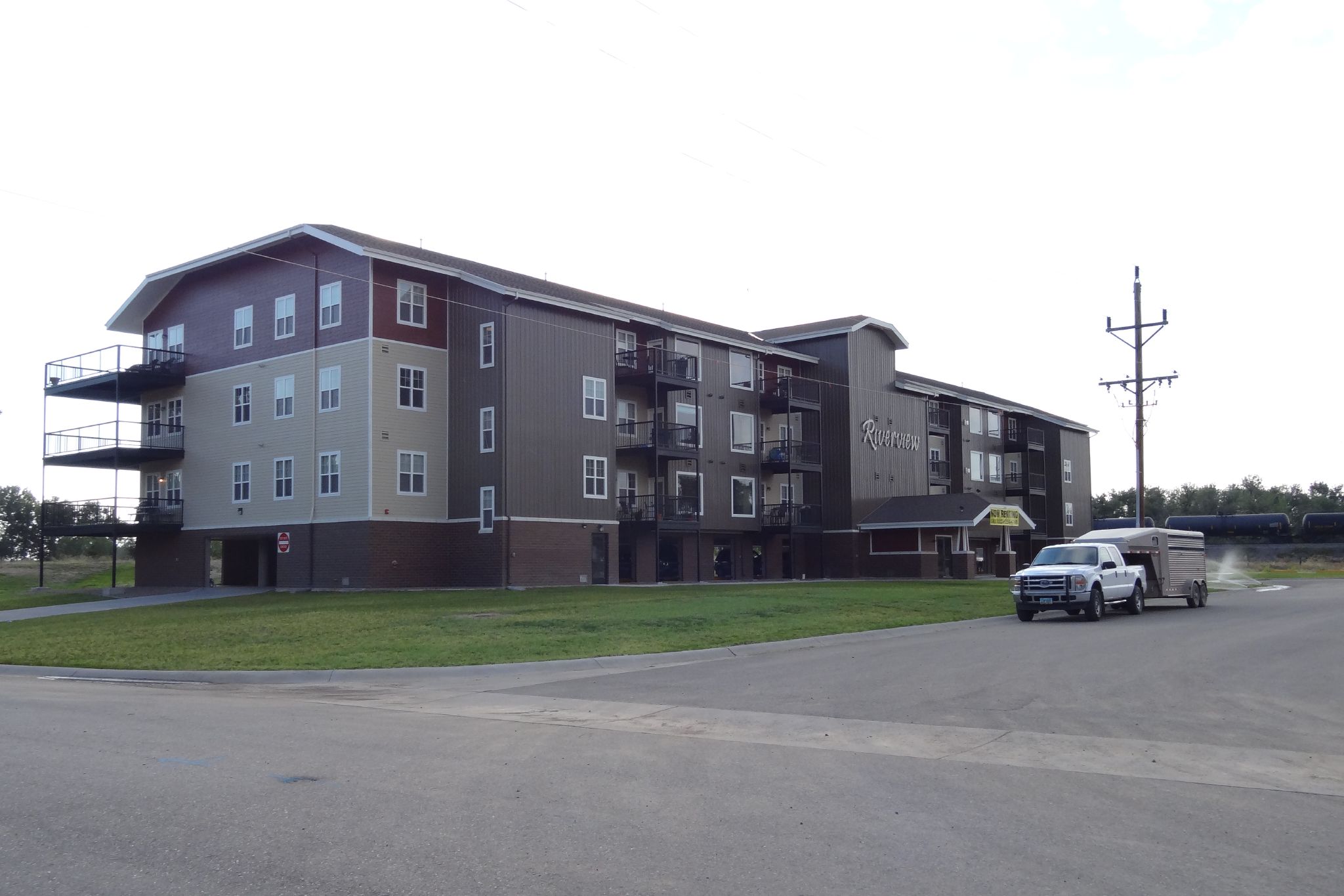 the cars are parked in front of the large building