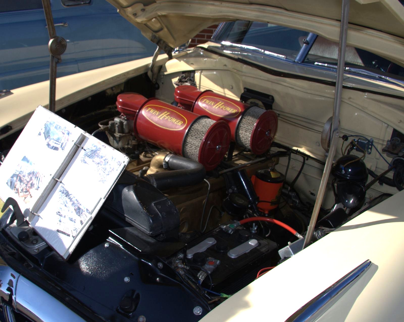 the engine compartment in a classic sports car