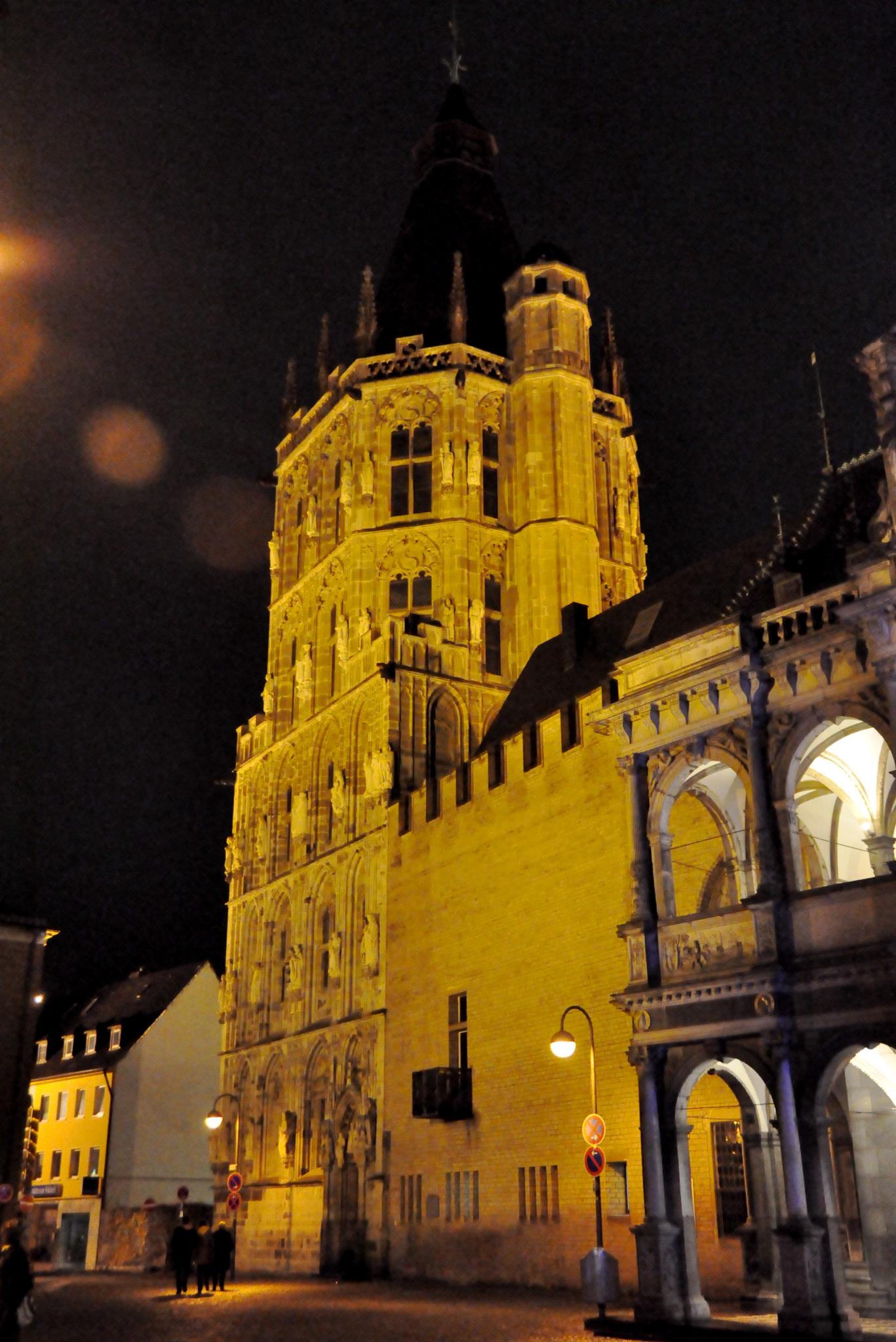 the lights shine on this gothic architecture at night