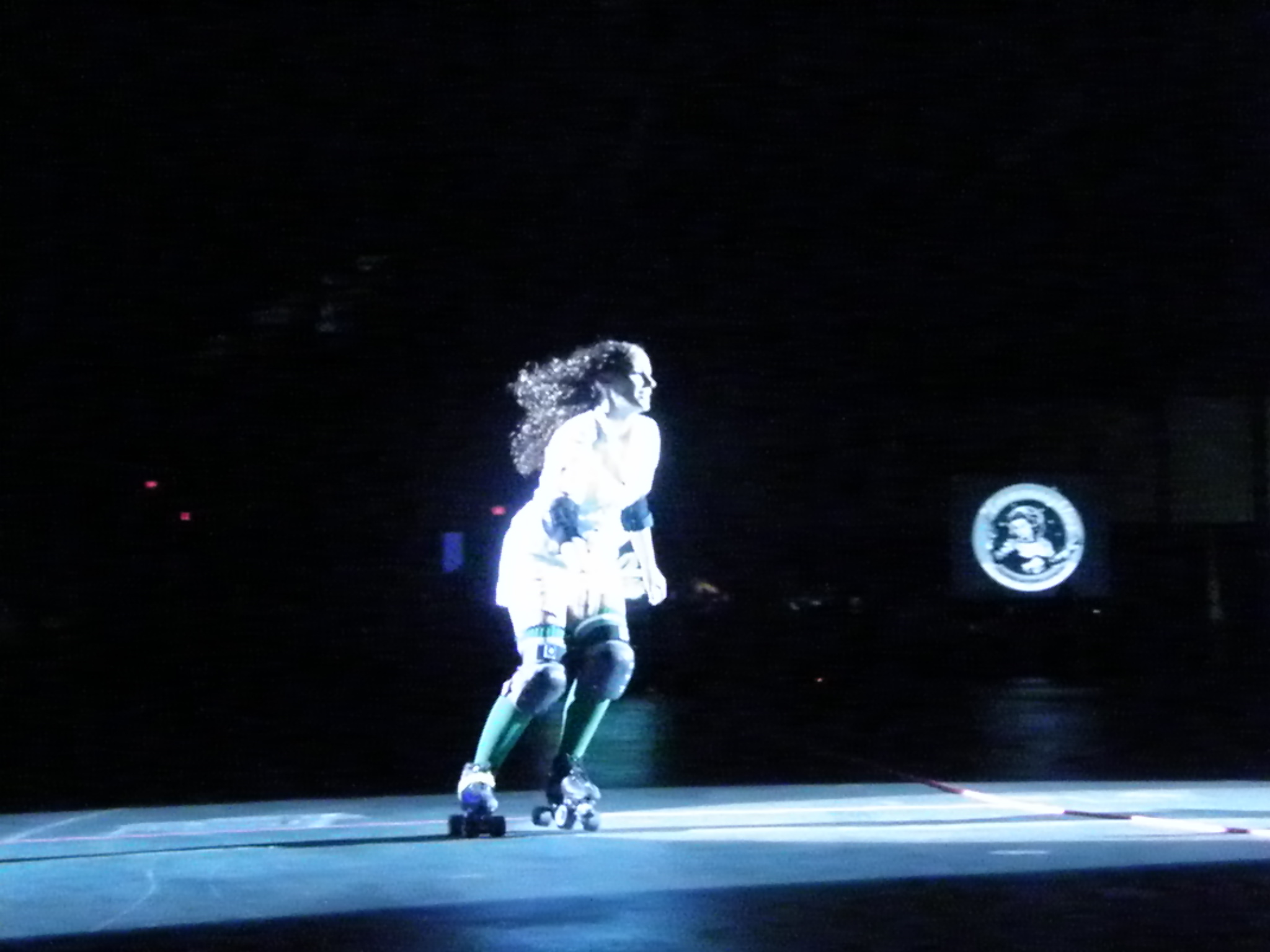 a woman on roller blades in the dark