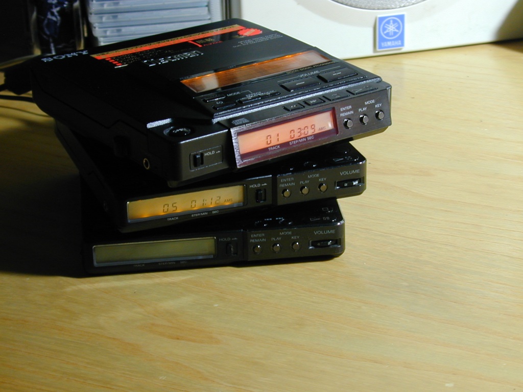 some electronic equipment and a stereo receiver on a desk