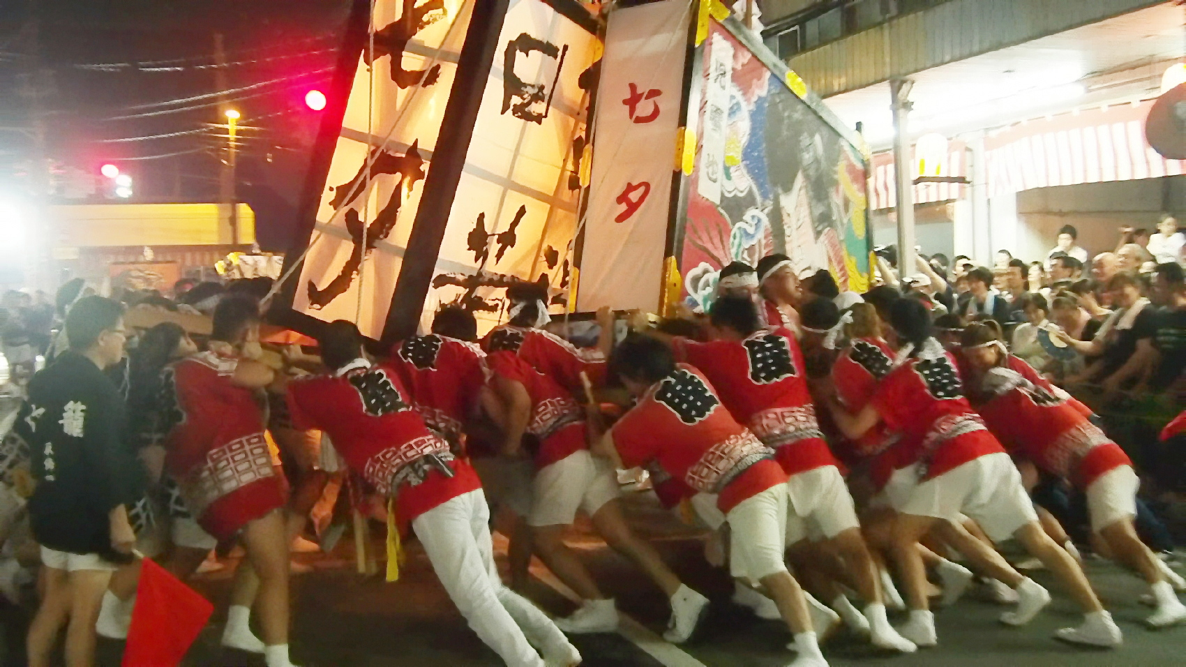 several male dancers are performing in the street