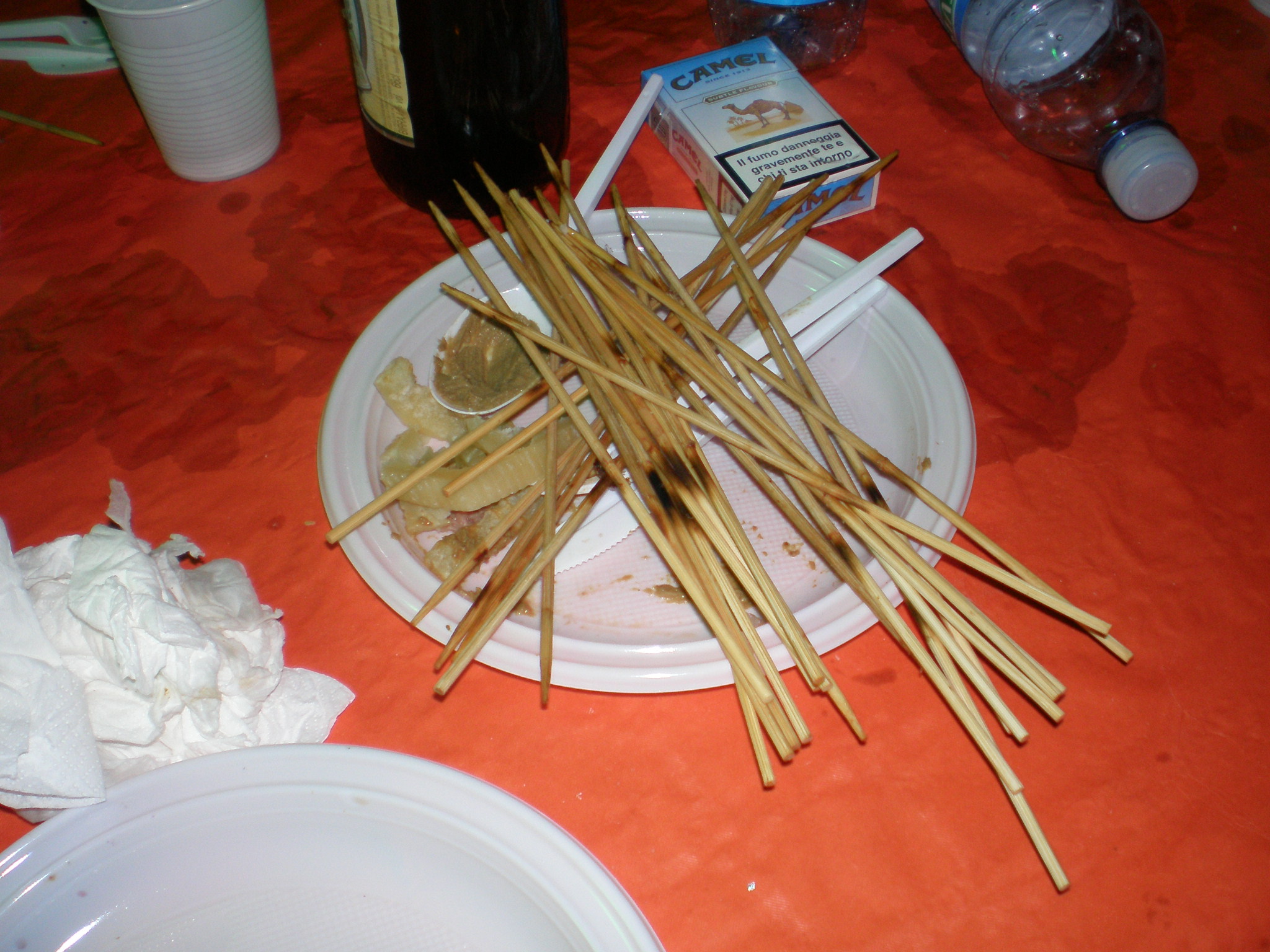 a white plate topped with lots of chop sticks