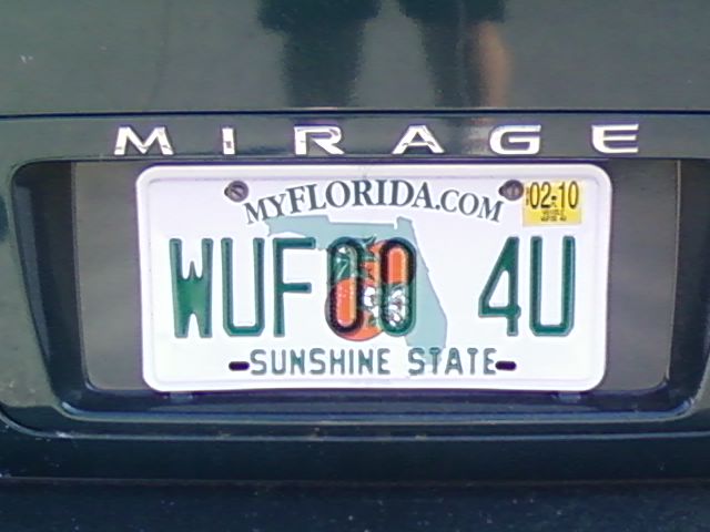 a number plate with the words huskies and a heart on it