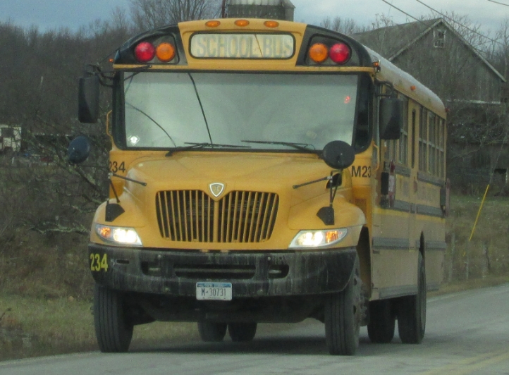 the back end of a yellow school bus