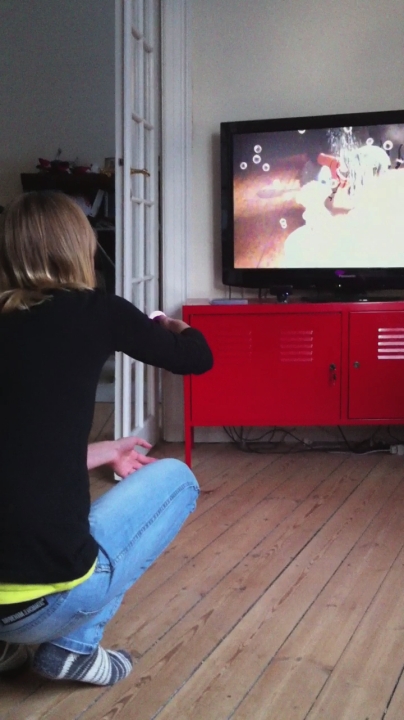 two women play wii games together on a tv
