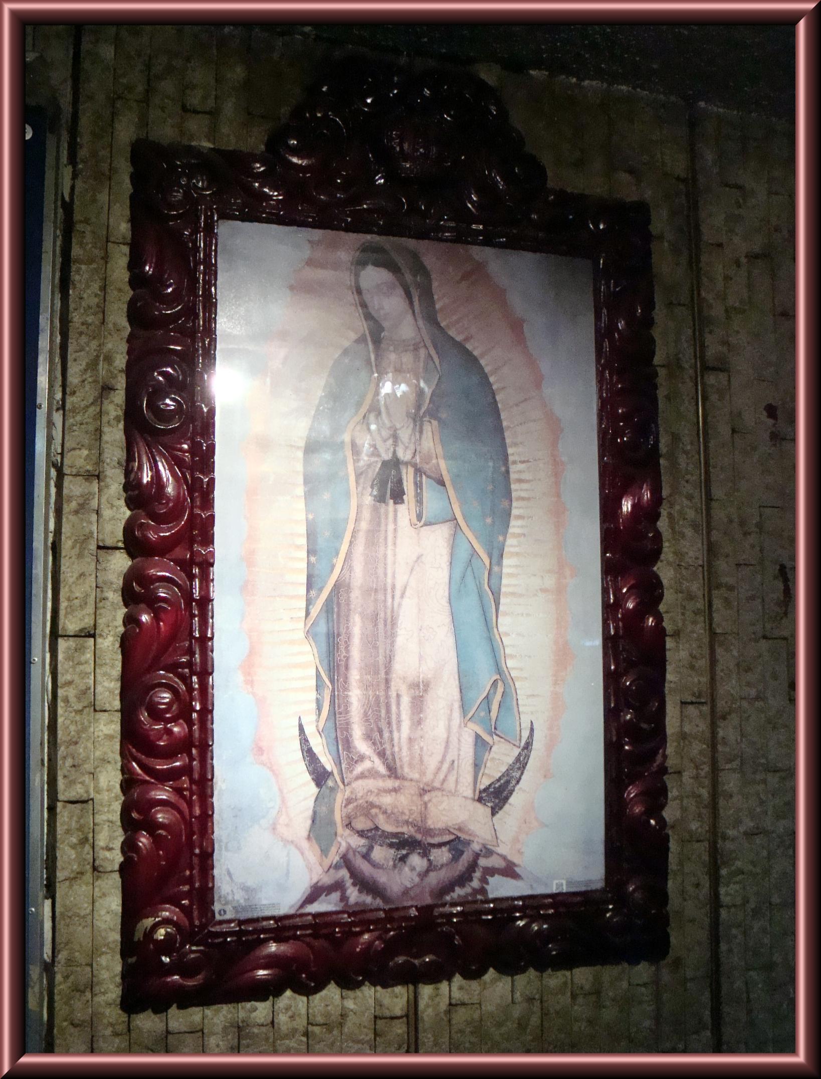 an image of the immaculate mary in a mirror