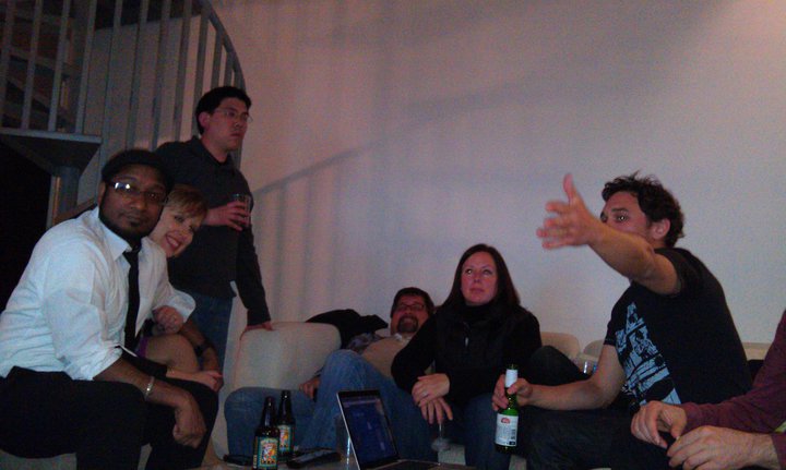 a group of people sitting on couches posing