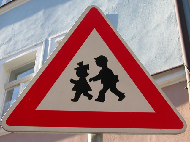 a traffic sign warning s that they may walk