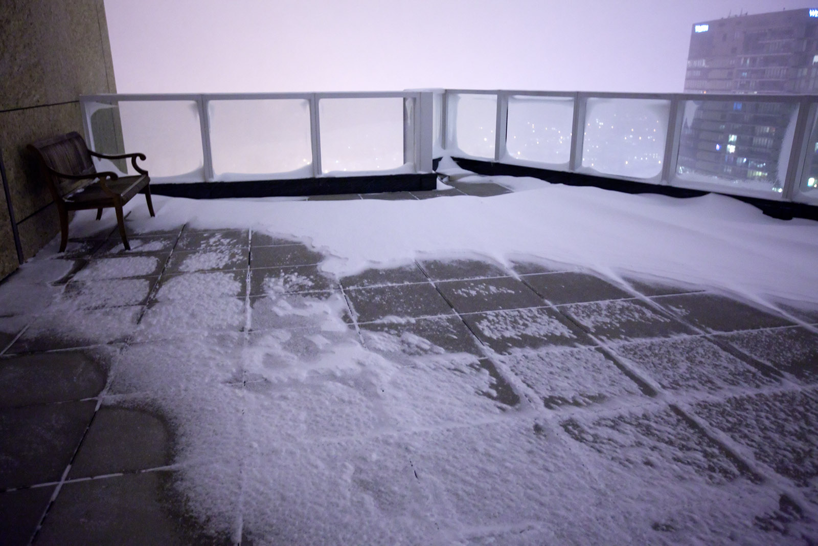 a view of some snow from the top floor of a building