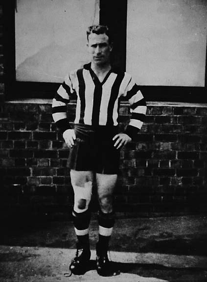 a black and white po of a young man in referee's uniform