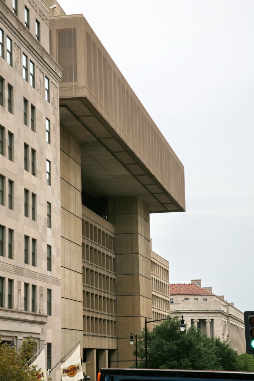 a street light on a city street near large buildings