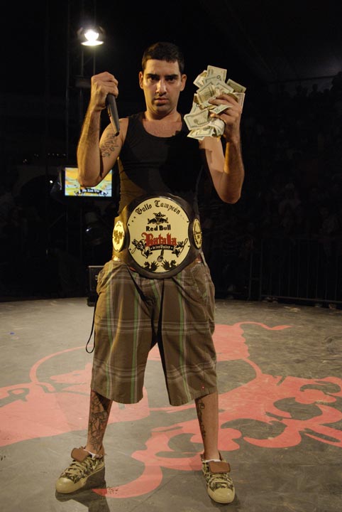 a man standing in a ring holding money