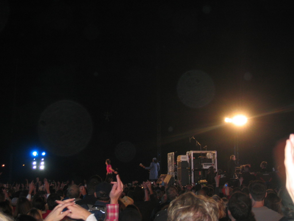 a group of people on a stage at night