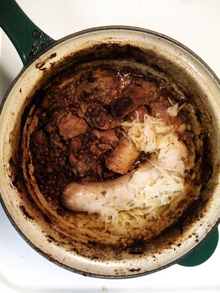 a large bowl with some meat and pasta in it