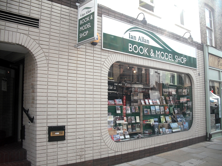 a book and mobile shop on a city street