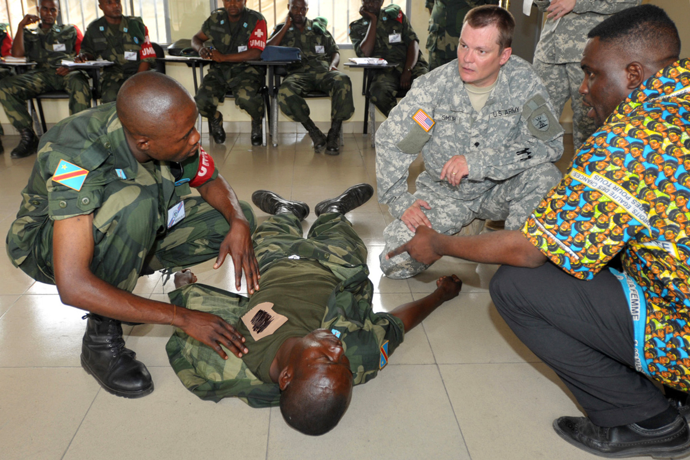two men are trying to fix a person in a military uniform