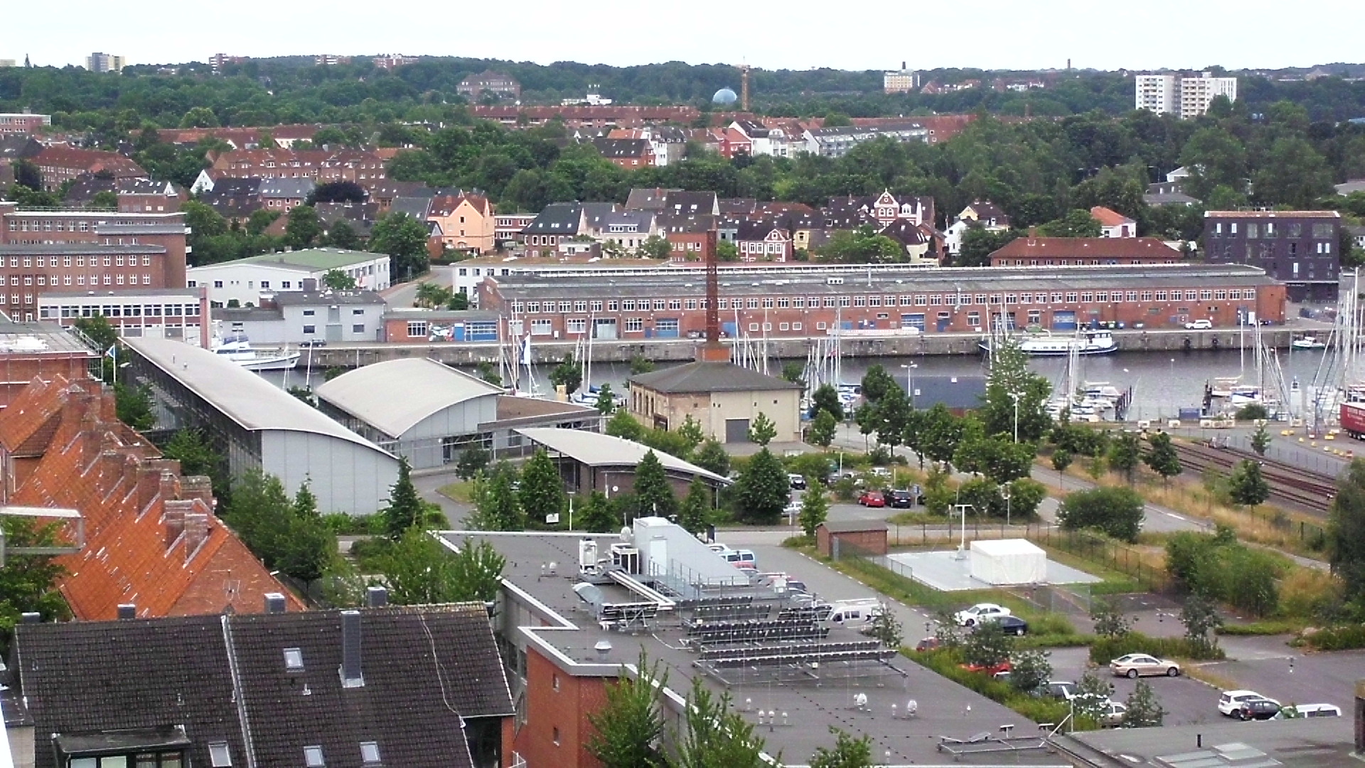 an urban area with buildings and lots of trees