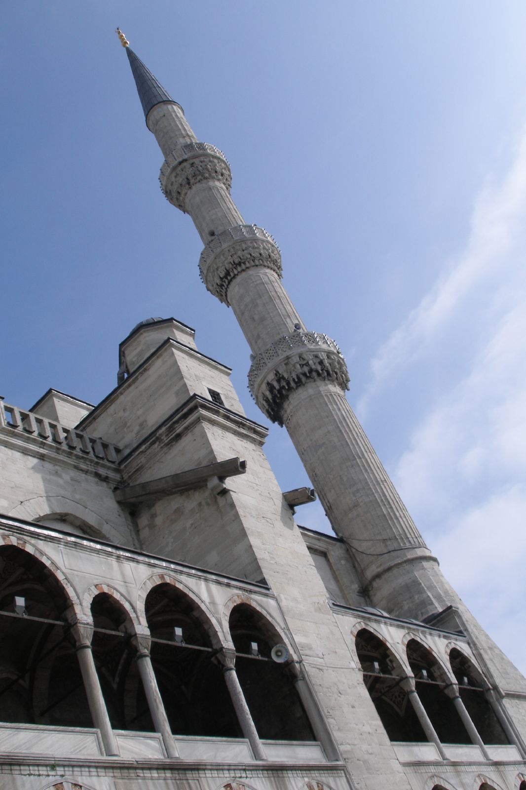 an ornately designed building has two pointed towers