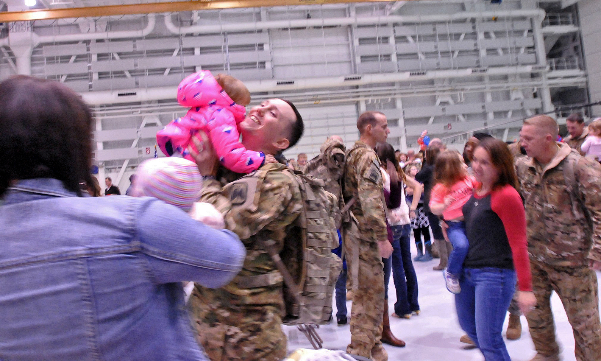 soldiers and military personnel greet each other in the air