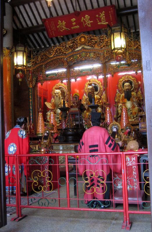 a shrine with red cloths inside is shown