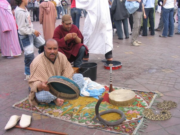 a man is selling items at a festival