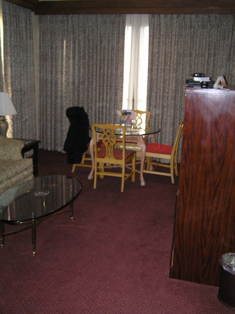 a large living room with a sofa and chairs
