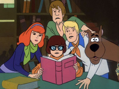 the cartoon gang is reading a book together