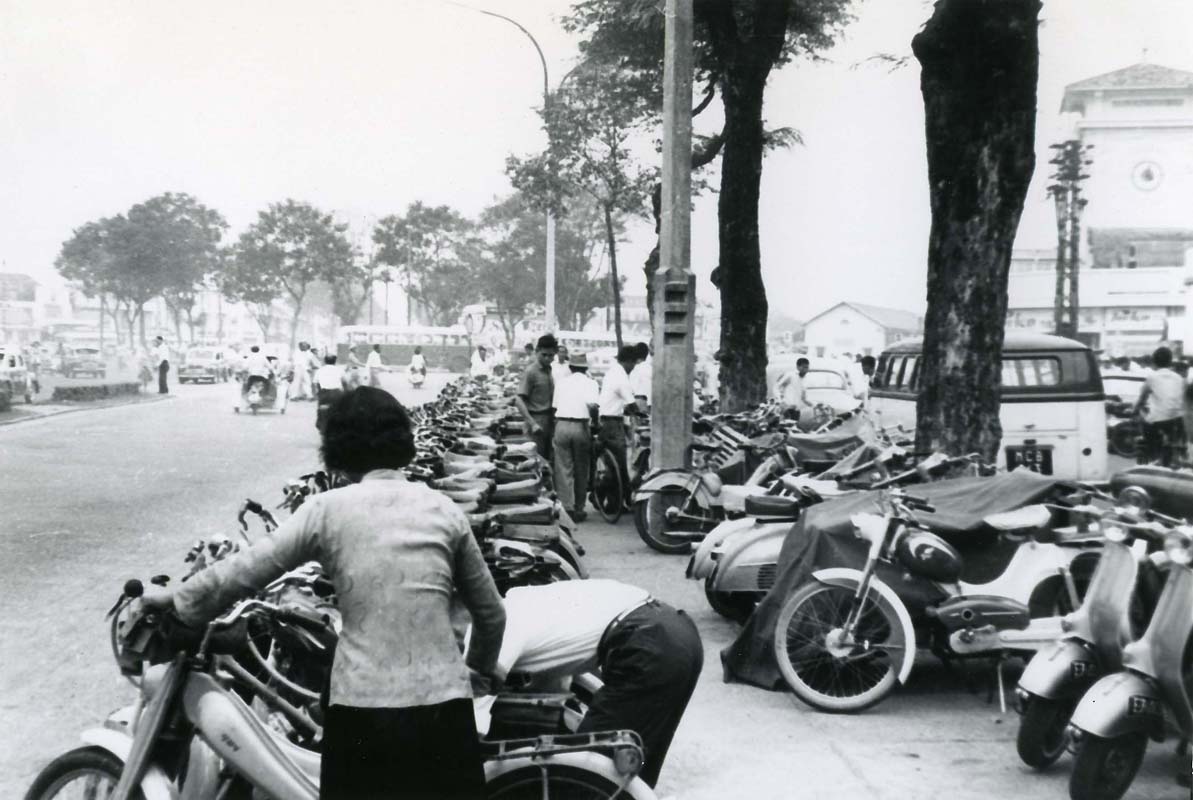 an old black and white po of people with their motorcycles