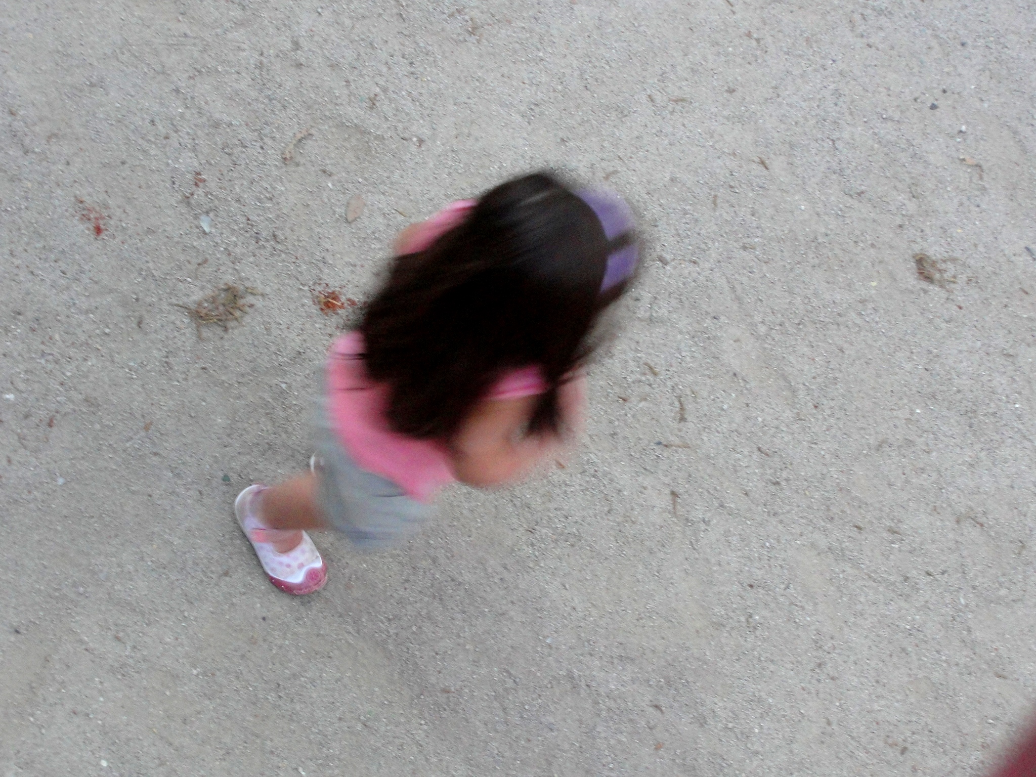 a  standing on top of a cement floor