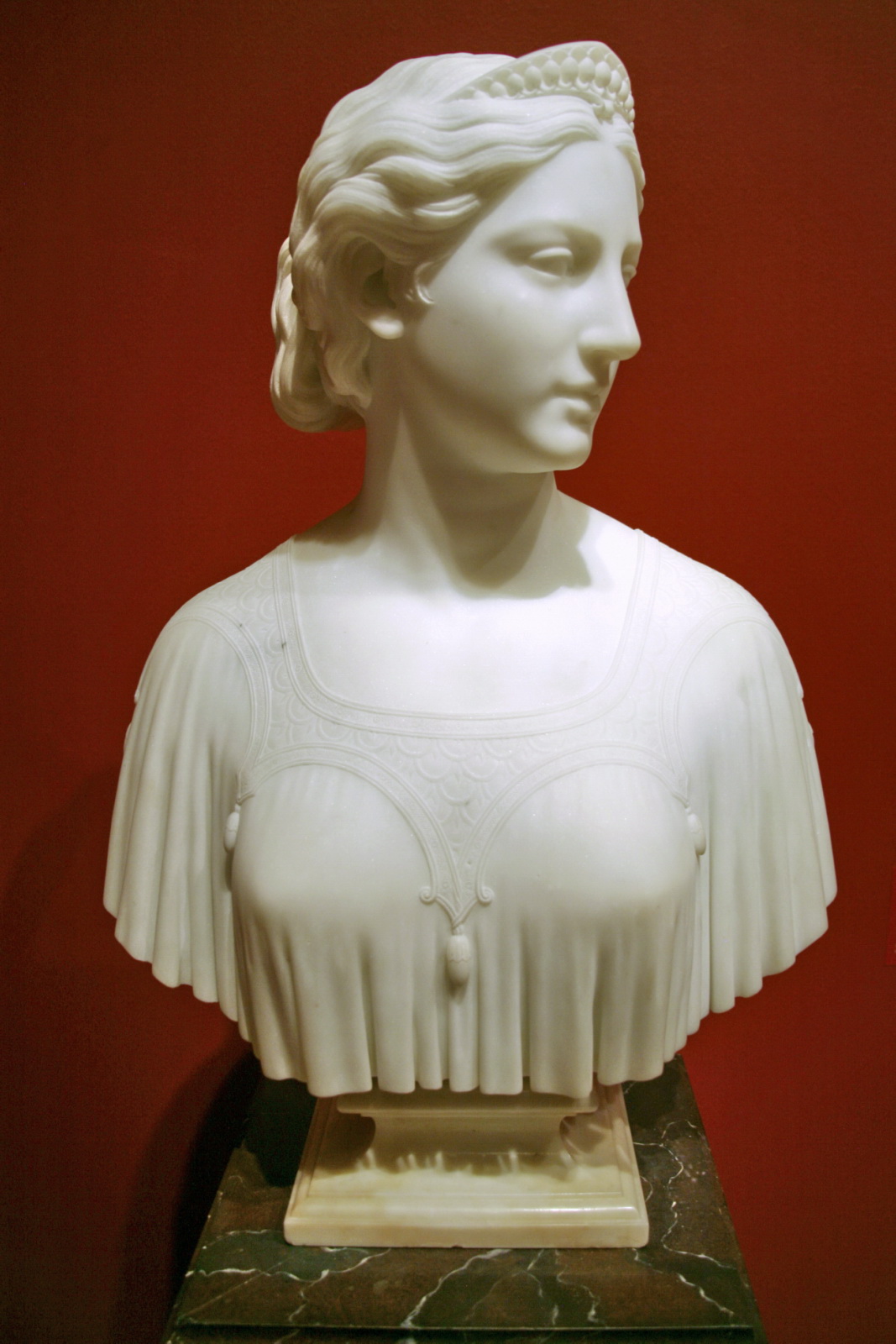 a bust of a woman wearing a corset