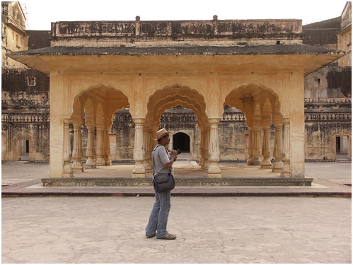 a person is standing in front of an old building