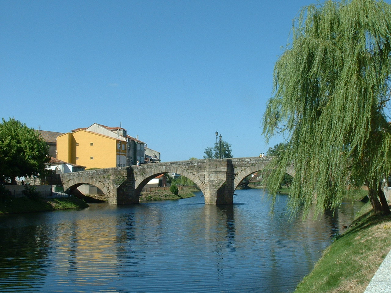 a river near buildings in a town